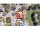 Aerial view of house with a red roof in lush surroundings, near a tranquil pond and waterways at 547 Island Walk, Mount Pleasant, SC 29464