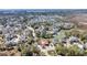 Expansive aerial view showcasing a community amidst waterways, ponds and lush green spaces at 547 Island Walk, Mount Pleasant, SC 29464