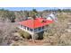 Aerial view of the home featuring a striking red roof and inviting porches at 547 Island Walk, Mount Pleasant, SC 29464
