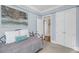 Cozy bedroom with light blue walls, neutral carpet, a metal-framed bed, and a large closet at 547 Island Walk, Mount Pleasant, SC 29464
