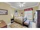 Bright bedroom featuring a bed with floral patterned bedding, neutral walls, and light-colored rug at 547 Island Walk, Mount Pleasant, SC 29464