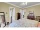 This bedroom offers neutral walls and carpet, along with an inviting bed adorned with sea life-themed bedding at 547 Island Walk, Mount Pleasant, SC 29464