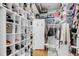 A bright walk-in closet with custom shelving for shoes, hats, and purses at 547 Island Walk, Mount Pleasant, SC 29464