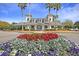 Community clubhouse with red and purple flowers in the landscape at 547 Island Walk, Mount Pleasant, SC 29464