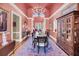 Formal dining room with chandelier, decorative rug, and elegant furnishings at 547 Island Walk, Mount Pleasant, SC 29464