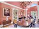 Open-concept dining area with chandelier and views to other living spaces at 547 Island Walk, Mount Pleasant, SC 29464