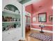 Charming entryway features hardwood floors, and displays a stylish console table and built in shelving at 547 Island Walk, Mount Pleasant, SC 29464