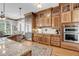 Well-appointed kitchen with stainless appliances, custom cabinets, and hardwood floors at 547 Island Walk, Mount Pleasant, SC 29464