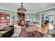 Open living space with a fireplace, grand piano, hardwood floors, and comfortable furnishings at 547 Island Walk, Mount Pleasant, SC 29464