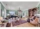 Spacious living room with hardwood floors, ample seating, piano, and decorative lighting fixture at 547 Island Walk, Mount Pleasant, SC 29464
