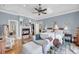 Spacious main bedroom featuring a fireplace, hardwood floors, a sitting area, and ample natural light at 547 Island Walk, Mount Pleasant, SC 29464