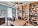 Home office featuring custom bookshelves, neutral walls, and lots of natural light at 547 Island Walk, Mount Pleasant, SC 29464