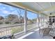 Scenic porch view of the water with white railings and comfortable seating at 547 Island Walk, Mount Pleasant, SC 29464