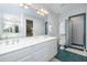 Bright bathroom with a double vanity, shower, and toilet providing a functional and stylish space at 6 4Th Ave, Isle of Palms, SC 29451