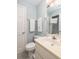 Bright bathroom featuring a white vanity, toilet, and fresh towels for a clean, welcoming space at 6 4Th Ave, Isle of Palms, SC 29451