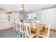 Dining room leading to living room with beautiful wood table, chairs and chandelier at 6 4Th Ave, Isle of Palms, SC 29451