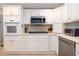 Well-organized kitchen with white cabinetry, stainless steel appliances, and plenty of storage space at 6 4Th Ave, Isle of Palms, SC 29451