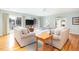 Spacious living room with hardwood floors, comfortable sofas, and access to an outdoor balcony with scenic views at 6 4Th Ave, Isle of Palms, SC 29451