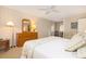 This bedroom features a main bed, dresser, and side door for convenient access to different parts of the home at 6 4Th Ave, Isle of Palms, SC 29451