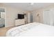 Spacious main bedroom with a dresser, TV, and access to ensuite bath and closet offering comfort and convenience at 6 4Th Ave, Isle of Palms, SC 29451