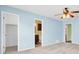 Bedroom with blue walls featuring ensuite access and closet at 611 Dolphin Drive Dr, Summerville, SC 29485