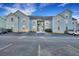 Inviting blue two-story condo with ample parking spaces in front and a well maintained exterior at 6275 Rolling Fork Rd # C, North Charleston, SC 29406