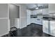 Functional kitchen adjacent to a laundry area, equipped with modern appliances and ample storage at 6275 Rolling Fork Rd # C, North Charleston, SC 29406