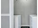 Laundry area with modern appliances and neutral tones at 6275 Rolling Fork Rd # C, North Charleston, SC 29406