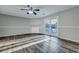Light-filled living room featuring wood floors, neutral walls, a fireplace, and sliding doors at 6275 Rolling Fork Rd # C, North Charleston, SC 29406