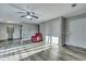 Spacious living room showcasing vinyl floors, a ceiling fan, and a cozy red armchair at 6275 Rolling Fork Rd # C, North Charleston, SC 29406