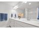 Bright bathroom featuring double sinks, a large mirror, white cabinets, shower and tub combination at 641 Sienna Way, Summerville, SC 29486