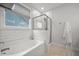 Clean bathroom featuring a tub, glass shower, and a neutral color palette, creating a spa-like ambiance at 641 Sienna Way, Summerville, SC 29486