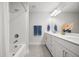 Bright bathroom featuring double sinks, a large mirror, white cabinets, shower and tub combination at 641 Sienna Way, Summerville, SC 29486