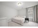 Minimalist bedroom with neutral colors, a twin bed, and a large window at 641 Sienna Way, Summerville, SC 29486