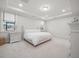 Bright bedroom with plush carpet, recessed lighting, and a comfortable bed with neutral bedding at 641 Sienna Way, Summerville, SC 29486