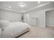 Large bedroom with soft carpet, a neutral color scheme, and tray ceilings for a peaceful retreat at 641 Sienna Way, Summerville, SC 29486
