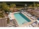 Inviting community pool with ample lounge chairs and adjacent playground offers a relaxing recreational space at 641 Sienna Way, Summerville, SC 29486