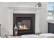 Close-up of a modern fireplace with a decorative mantle and hearth, providing a focal point in the living space at 641 Sienna Way, Summerville, SC 29486