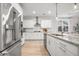New kitchen with stainless steel appliances, white cabinets, island and granite countertops at 641 Sienna Way, Summerville, SC 29486