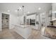 Bright, open kitchen with marble countertops, stainless appliances and an island with sink at 641 Sienna Way, Summerville, SC 29486