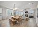 Open-concept living and dining area with fireplace, large windows and modern furniture at 641 Sienna Way, Summerville, SC 29486