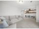 Spacious living room with a comfortable gray sofa and built-in shelving at 641 Sienna Way, Summerville, SC 29486