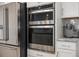 Stainless steel double oven and refrigerator enhance the kitchen's modern aesthetic at 641 Sienna Way, Summerville, SC 29486