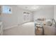 Bright sitting room with a plush sofa, a silver side table, and French doors at 641 Sienna Way, Summerville, SC 29486