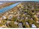 A waterfront community with lush trees, a golf course, and docks along a tranquil river at 7 Seahorse Ct, Isle of Palms, SC 29451