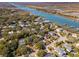 An aerial view of a scenic residential neighborhood featuring waterfront properties and lush greenery at 7 Seahorse Ct, Isle of Palms, SC 29451