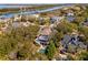 Breathtaking aerial view of a home with a pool and a scenic backdrop featuring a river and waterfront at 7 Seahorse Ct, Isle of Palms, SC 29451
