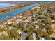 This waterfront community features lush trees, golf course, and docks along a tranquil river at 7 Seahorse Ct, Isle of Palms, SC 29451