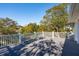 A bright back deck features a white railing and views of the nearby landscape at 7 Seahorse Ct, Isle of Palms, SC 29451