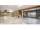 A large open basement with exposed ceiling with stairs and a ground-level paneled garage door at 7 Seahorse Ct, Isle of Palms, SC 29451